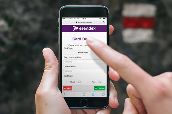 Someone entering card details on a smartphone