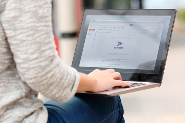 A person typing on a laptop