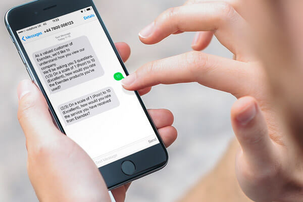 Someone holding a smartphone answering SMS